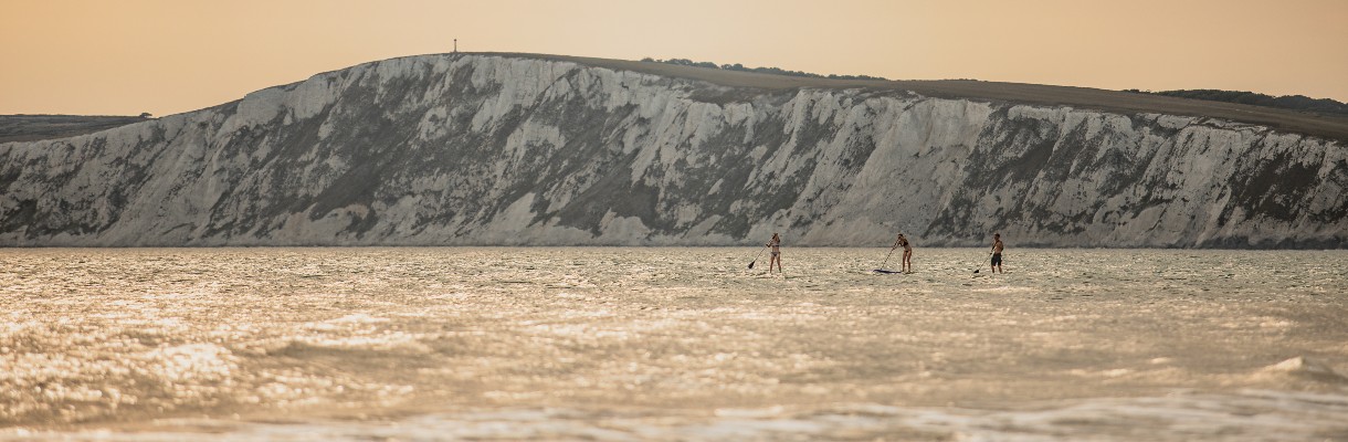Group paddle boarding in the sea